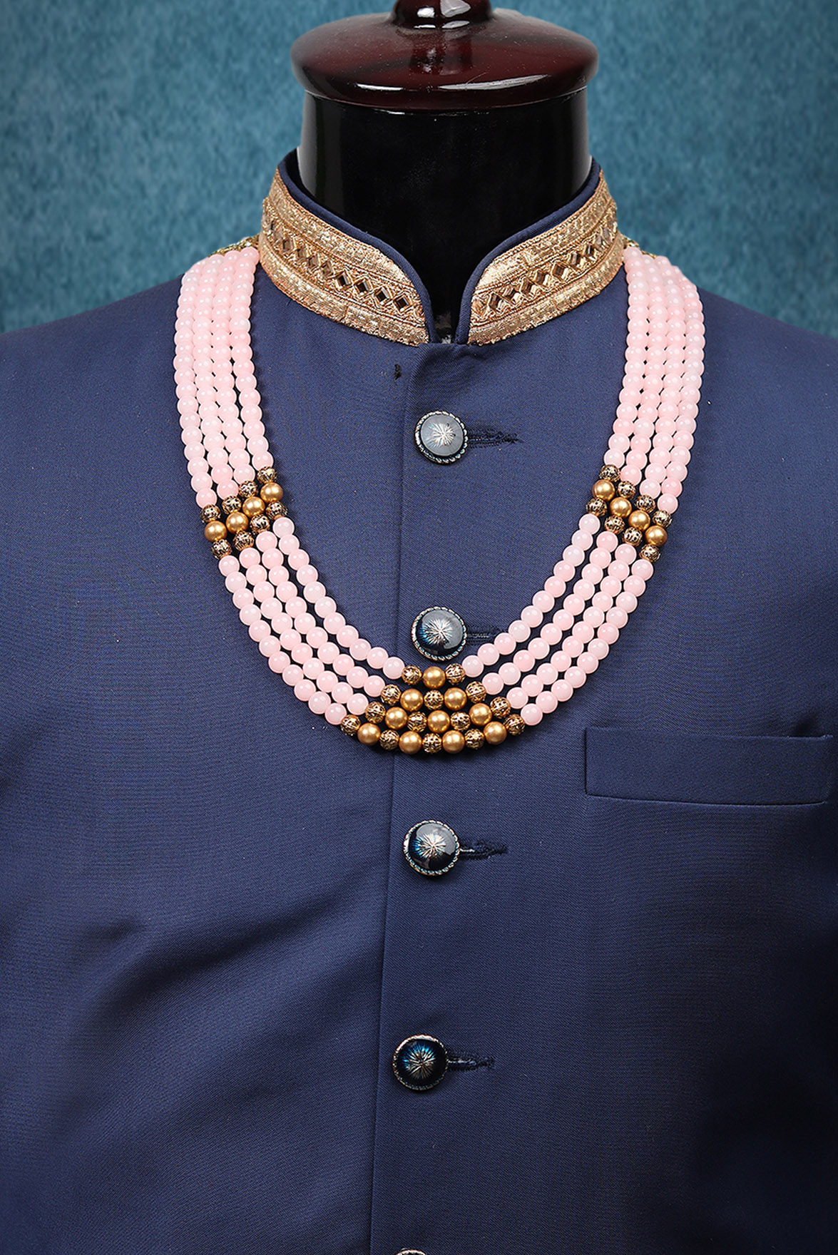 Baby Pink Mothi Mala With Golden Beads And White Stone Side Rings With A Triangle Structural Pattern In The Center Front
