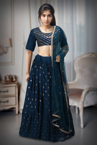 Deep Blue Georgette Flared Lehenga With Heavy Embellished Blouse And Net Dupatta