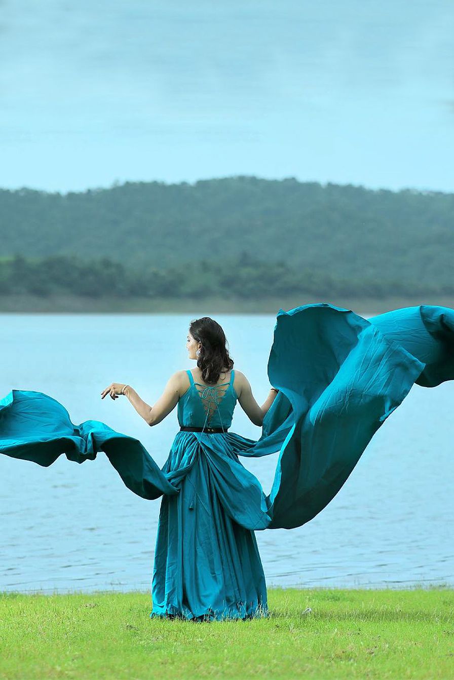 Iris Blue Sleeveless Gown with Three Panels Attached From the Waist area